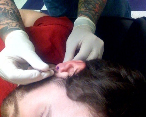 Ear piercing with needle